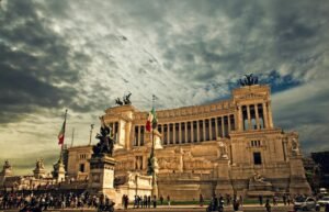 Stunning view of the Victor Emmanuel II Monument in Rome under dramatic skies.
